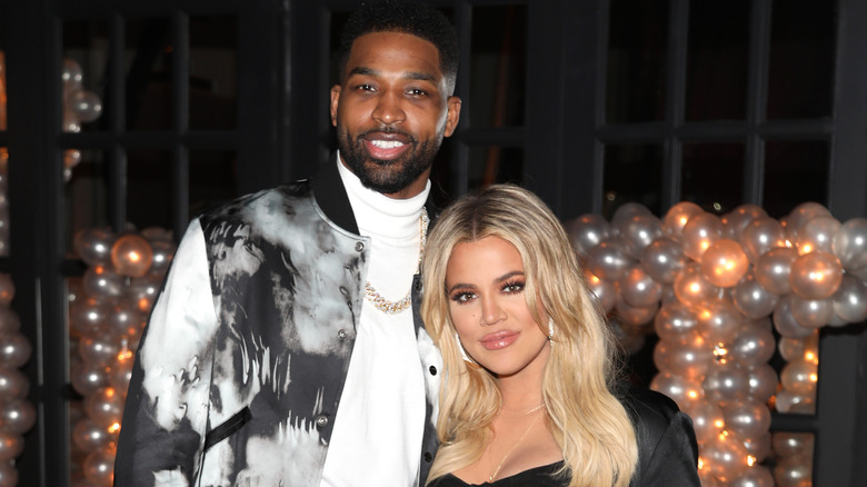 Tristan Thompson and Khloe Kardashian posing at his birthday party