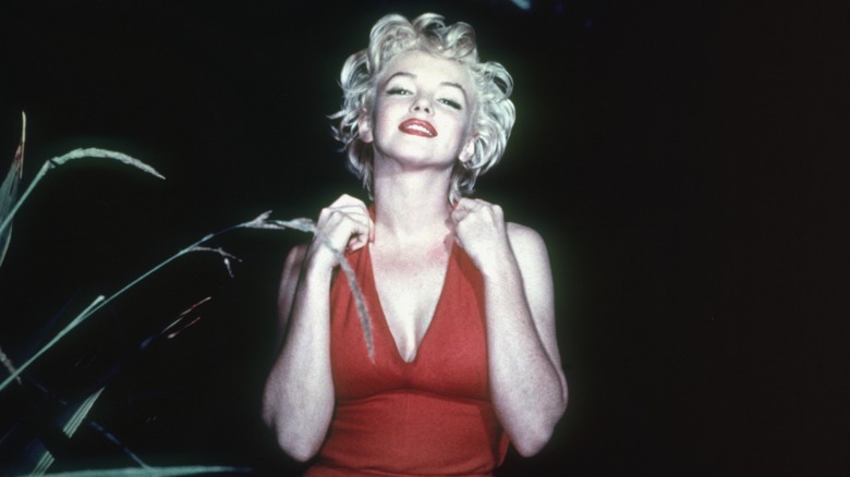 Marilyn Monroe wearing a red dress 