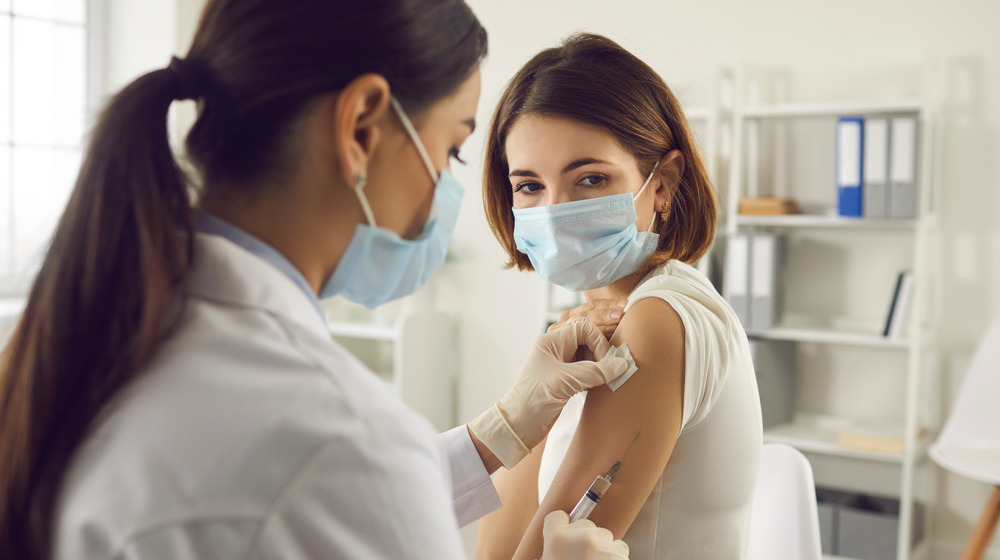 woman receiving vaccine
