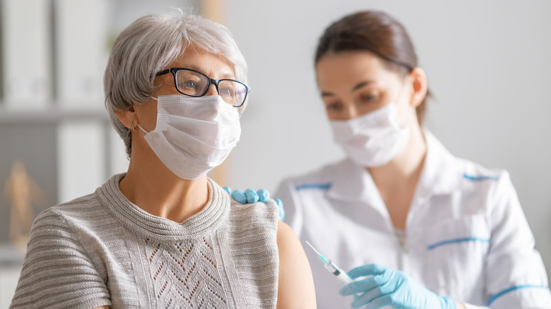 Woman getting COVID vaccine