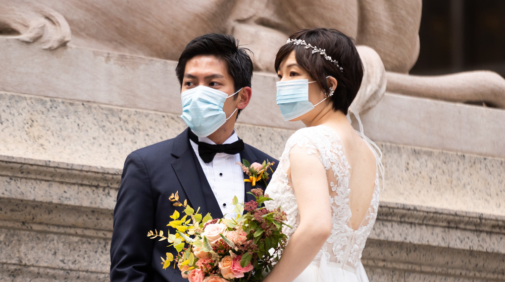 Masked couple getting married