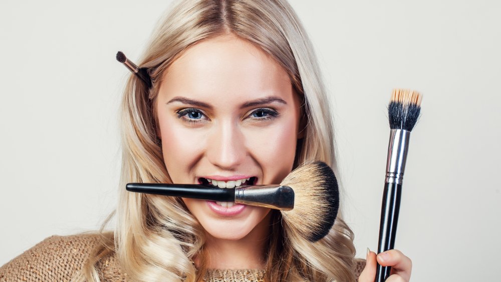 woman with makeup brush