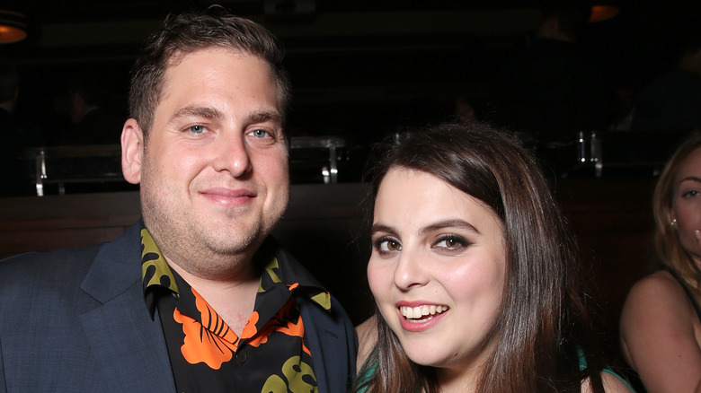 Jonah Hill and Beanie Feldstein pose at an event together