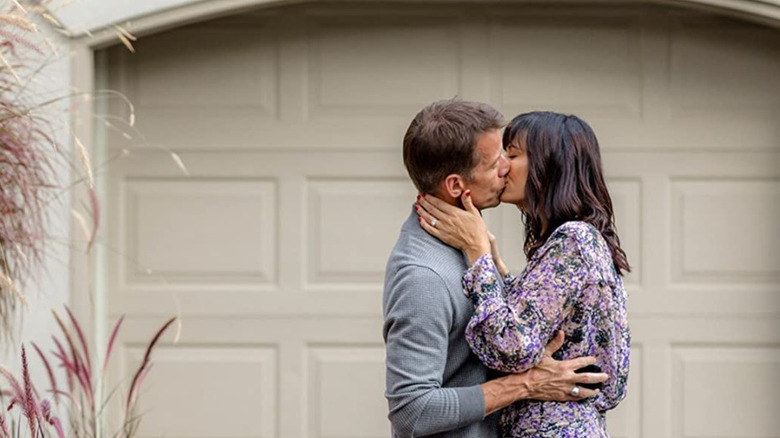 James Denton and Catherine Bell kissing