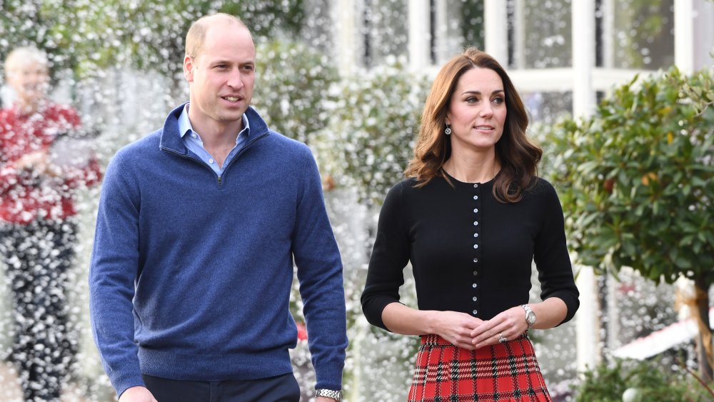 Prince William and Kate Middleton walking outside at Christmas