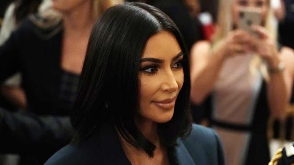 Kim Kardashian with a slight smile