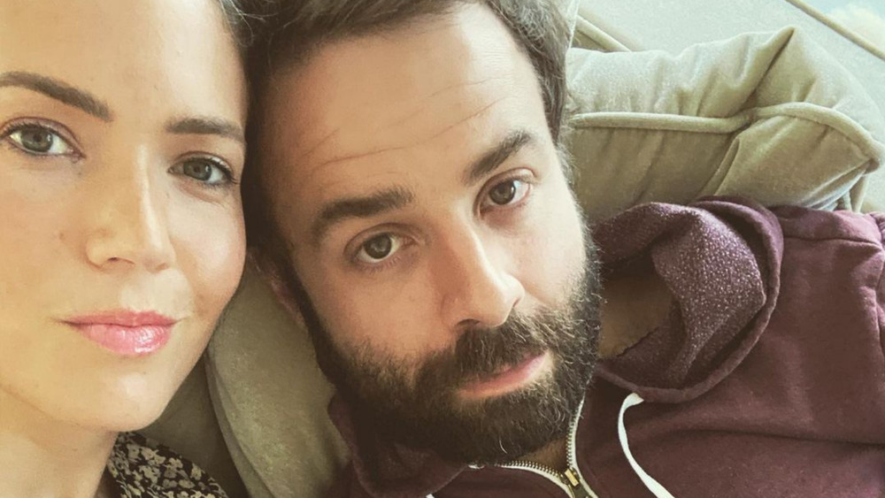 Mandy Moore and Taylor Goldsmith on a couch