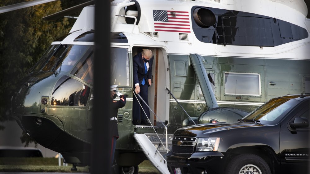 Trump exits helicopter