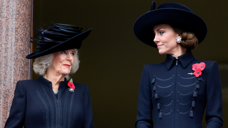 Queen Camilla and Kate Middleton smile at each other