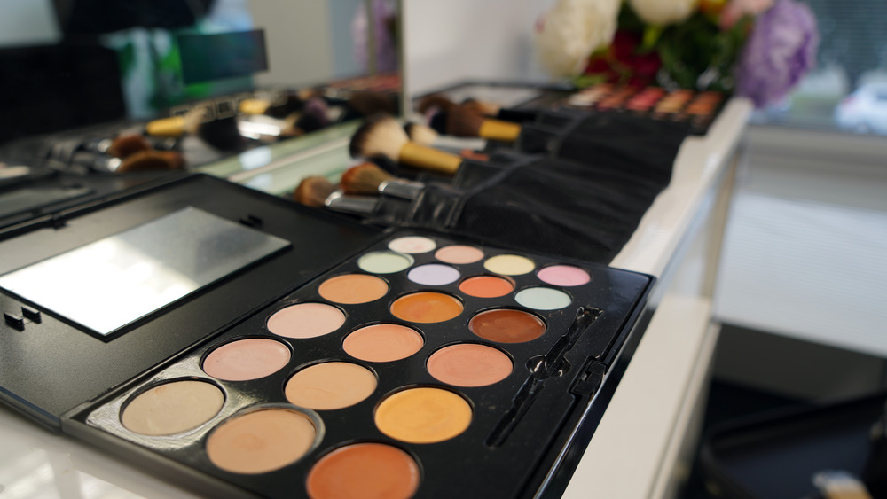 Professional makeup station with eye shadow and brushes