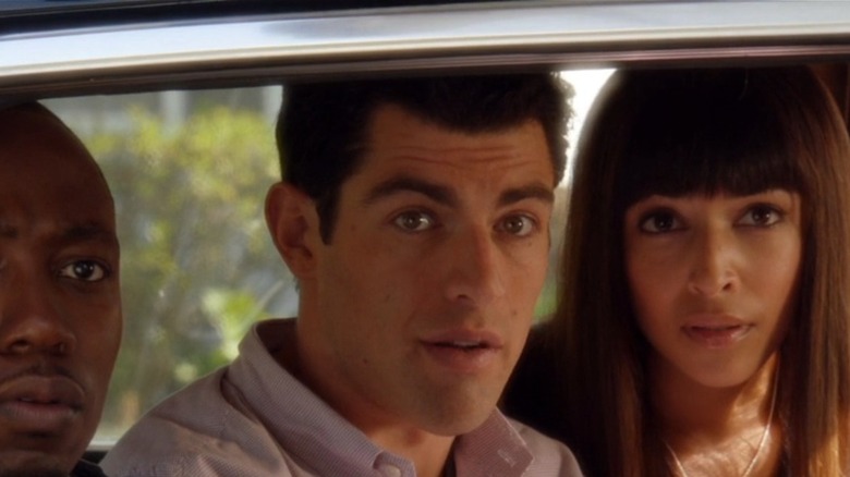 Lamorne Morris, Max Greenfield, and Hannah Simone in the back seat of a car in NEW GIRL