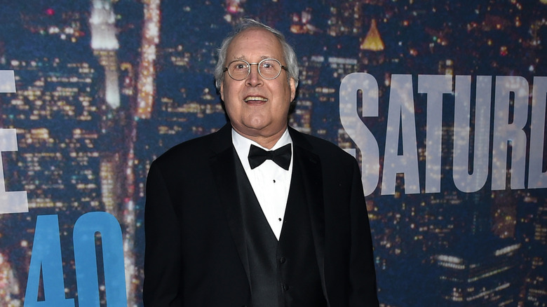 Chevy Chase posing at the SNL 40th anniversary event