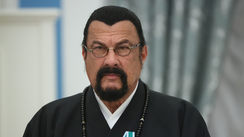 Steven Seagal looking stern while receiving an award