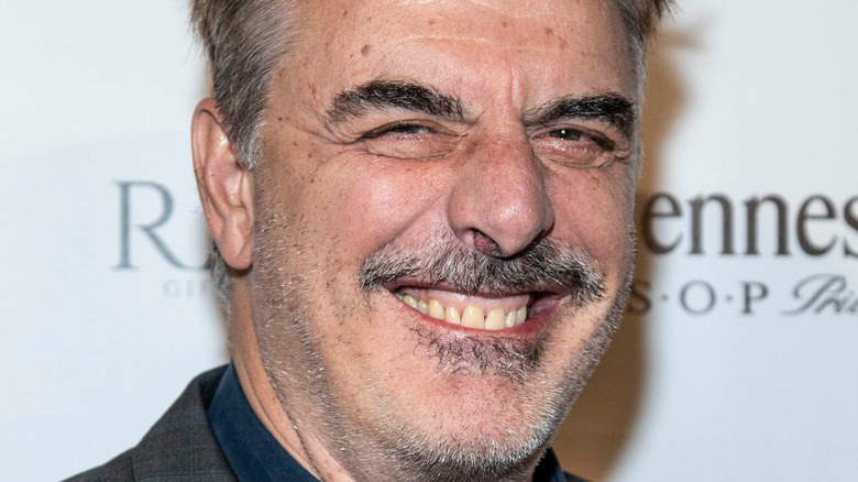 Chris Noth smiling at event