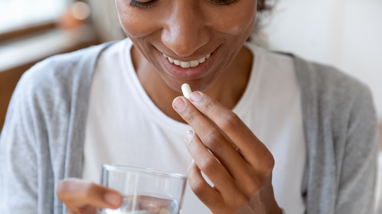 Woman taking medication