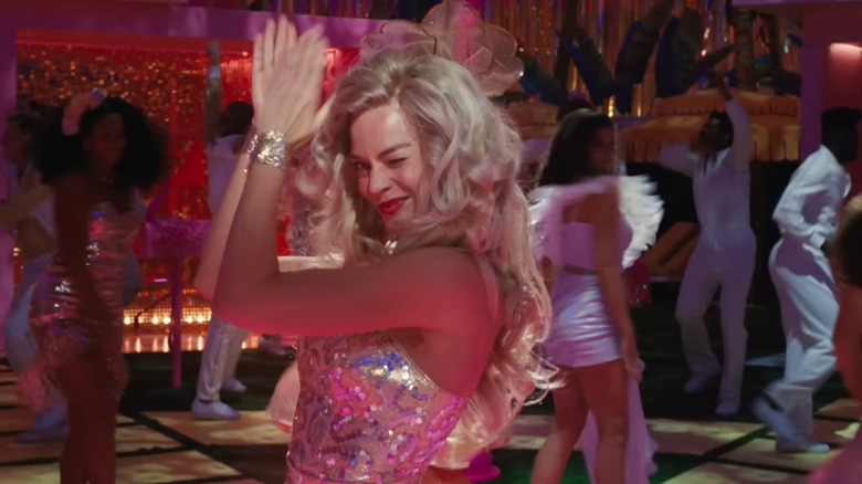 Margot Robbie as Barbie winking