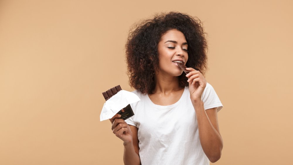 woman enjoying dark chocolate