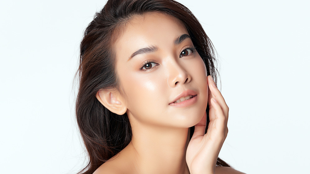 Woman with dewy, glowing skin