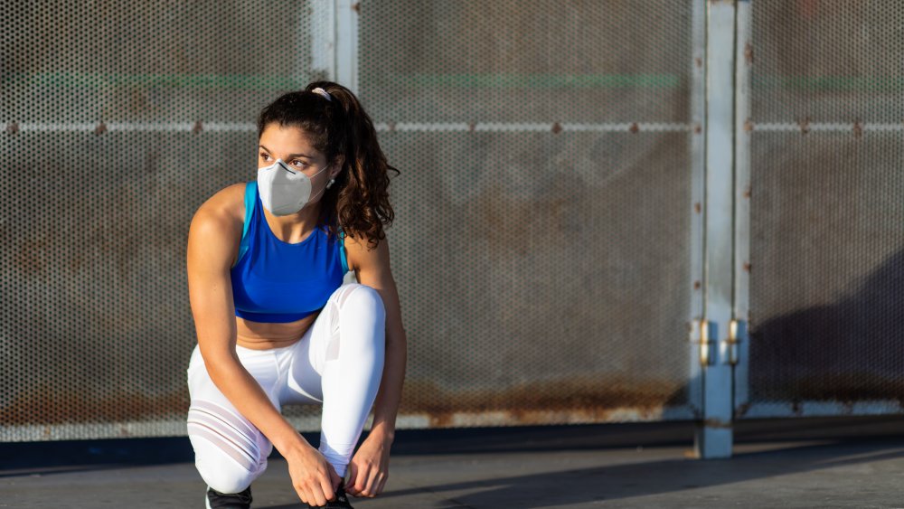 Woman getting ready to work out outside