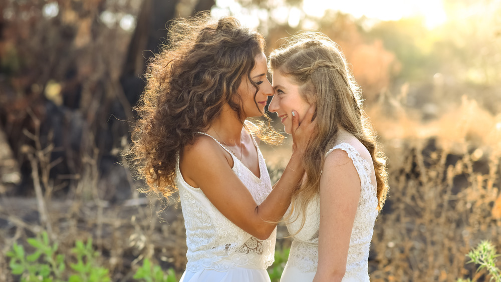 two brides outside