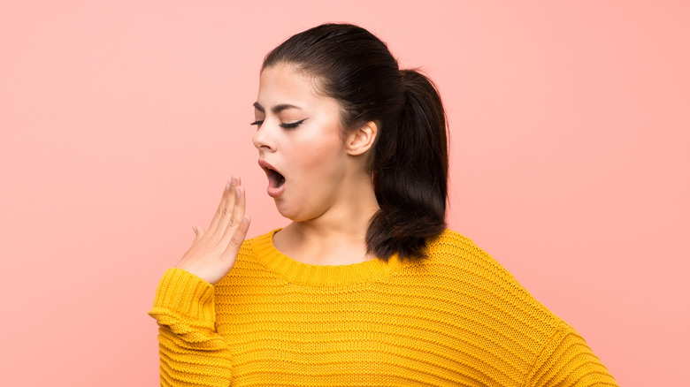 Woman yawning