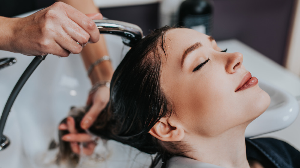 Woman getting hair washed