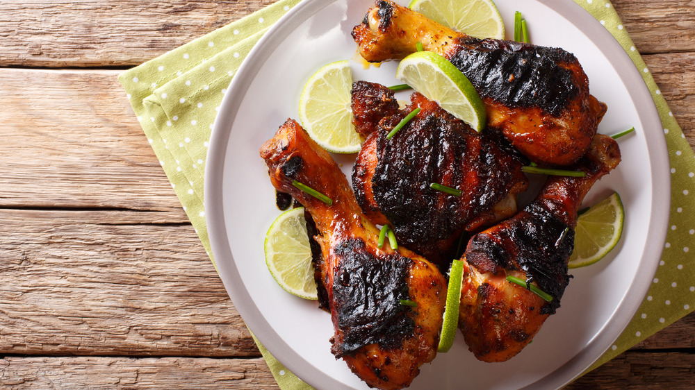 A plate of burnt chicken 