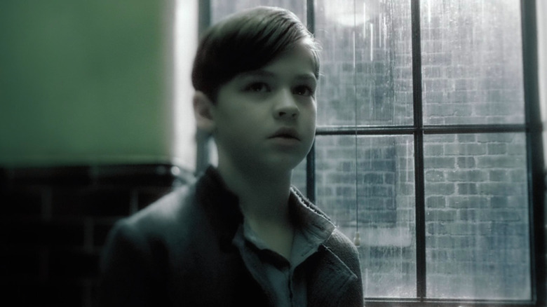 Young Hero Fiennes Tiffin as Tom Riddle 