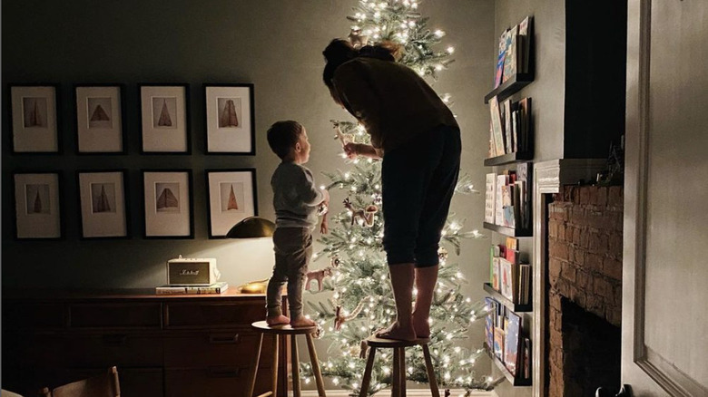 Joanna Gaines and son, Crew, setting up their Christmas tree