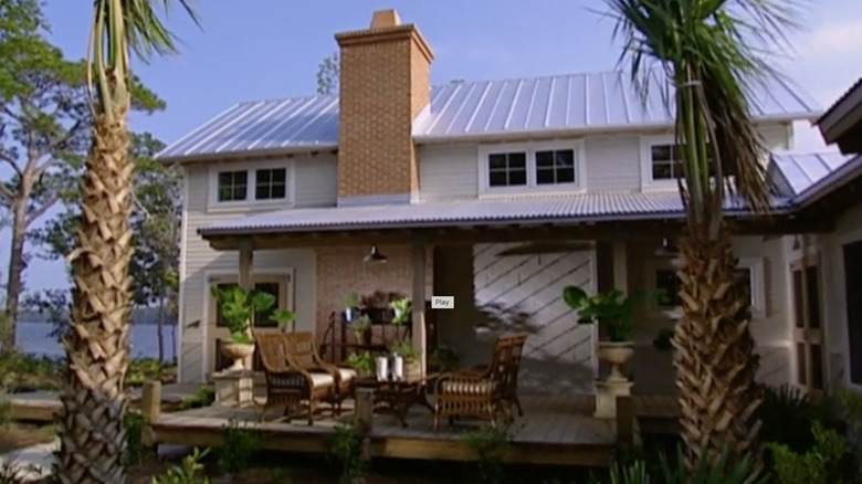 Big house surrounded by palm trees