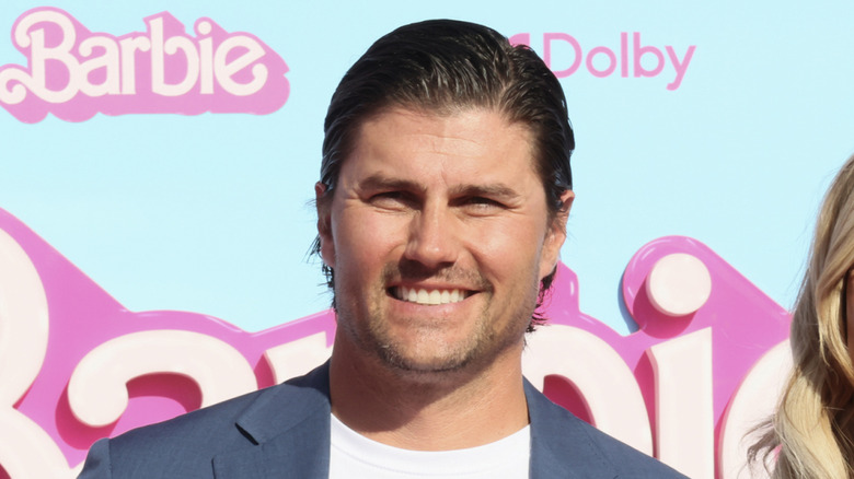 Josh Hall smiling at the camera at the Barbie movie premiere