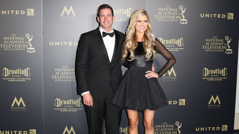 Tarek El Moussa Christina Hall smiling, side-hugging