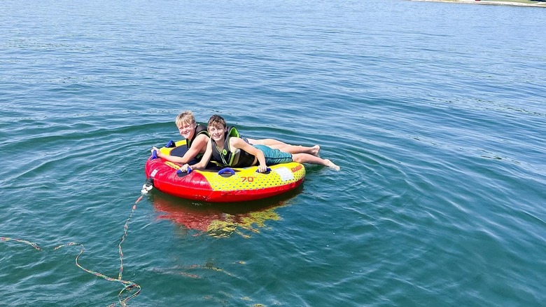 Jenny Marrs two sons on a tube on the water