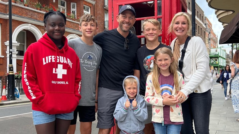 The Marrs pose by a red London phone booth