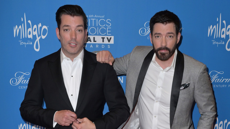 Jonathan Scott and Drew Scott wearing suits