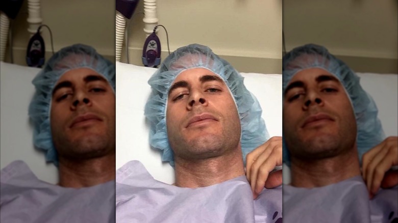 Tarek El Moussa in a hospital bed