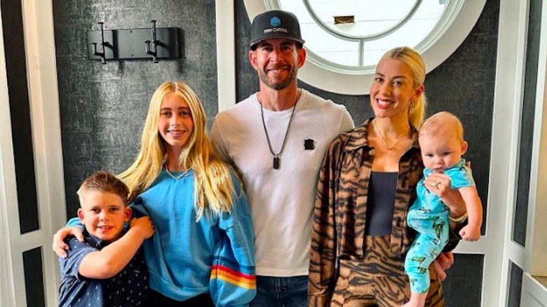 Tarek El Moussa with his wife and three children