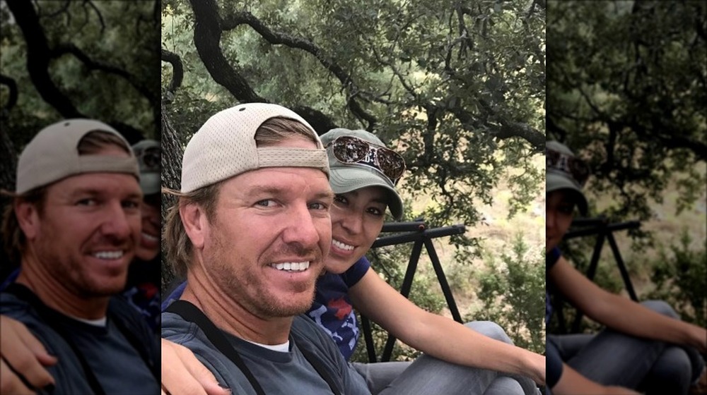 Chip and Joanna Gaines sitting outside