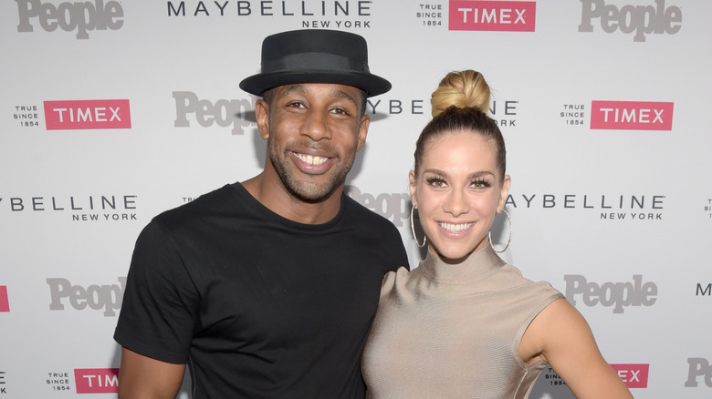 tWitch and Allison Holker pose for photos on the red carpet