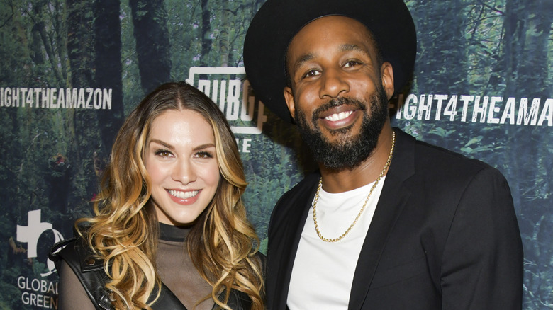 Allison Holker and tWitch posing on the red carpet