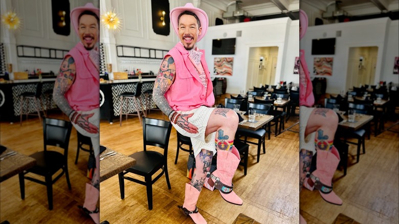 David Bromstad posing in a pink cowboy outfit