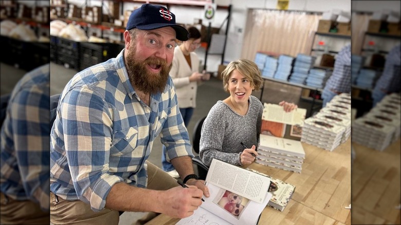 Ben and Erin Napier signing books