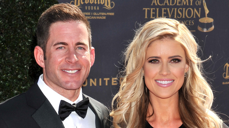 Christina Hall and Tarek El Moussa pose on the red carpet together