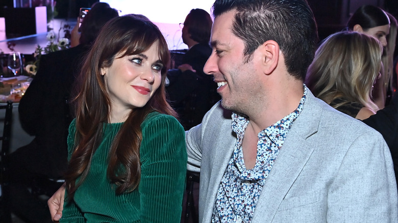 Zooey Deschanel looks at smiling Jonathan Scott