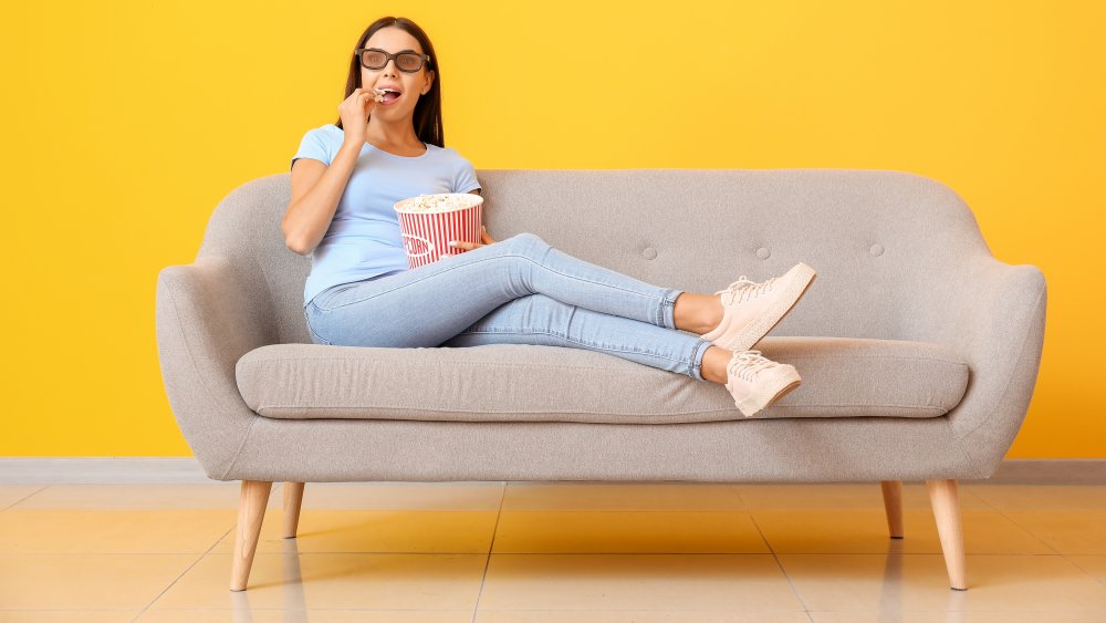 Woman eating popcorn