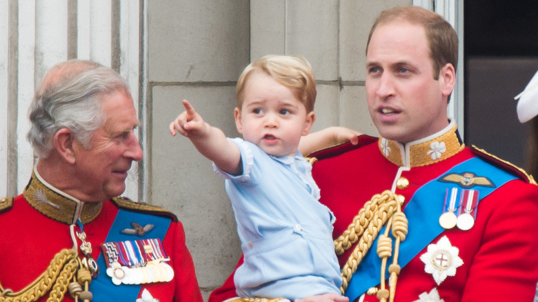 King Charles III with Prince William and Prince George