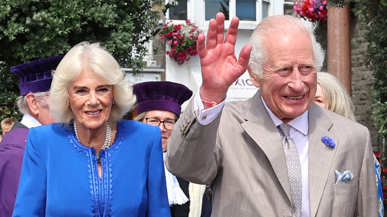 king charles III waving with Queen Camilla