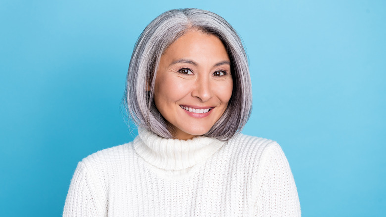 woman with grey hair smiling 