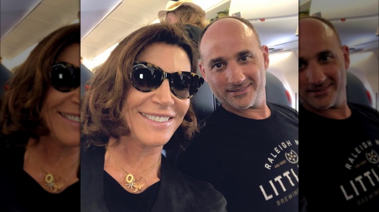 Hilary Farr and David Visentin posing for a plane selfie 