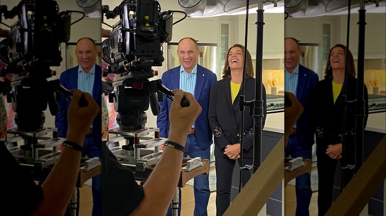 David Visentin and Hilary Farr laughing together on the set of "Love It or List It"